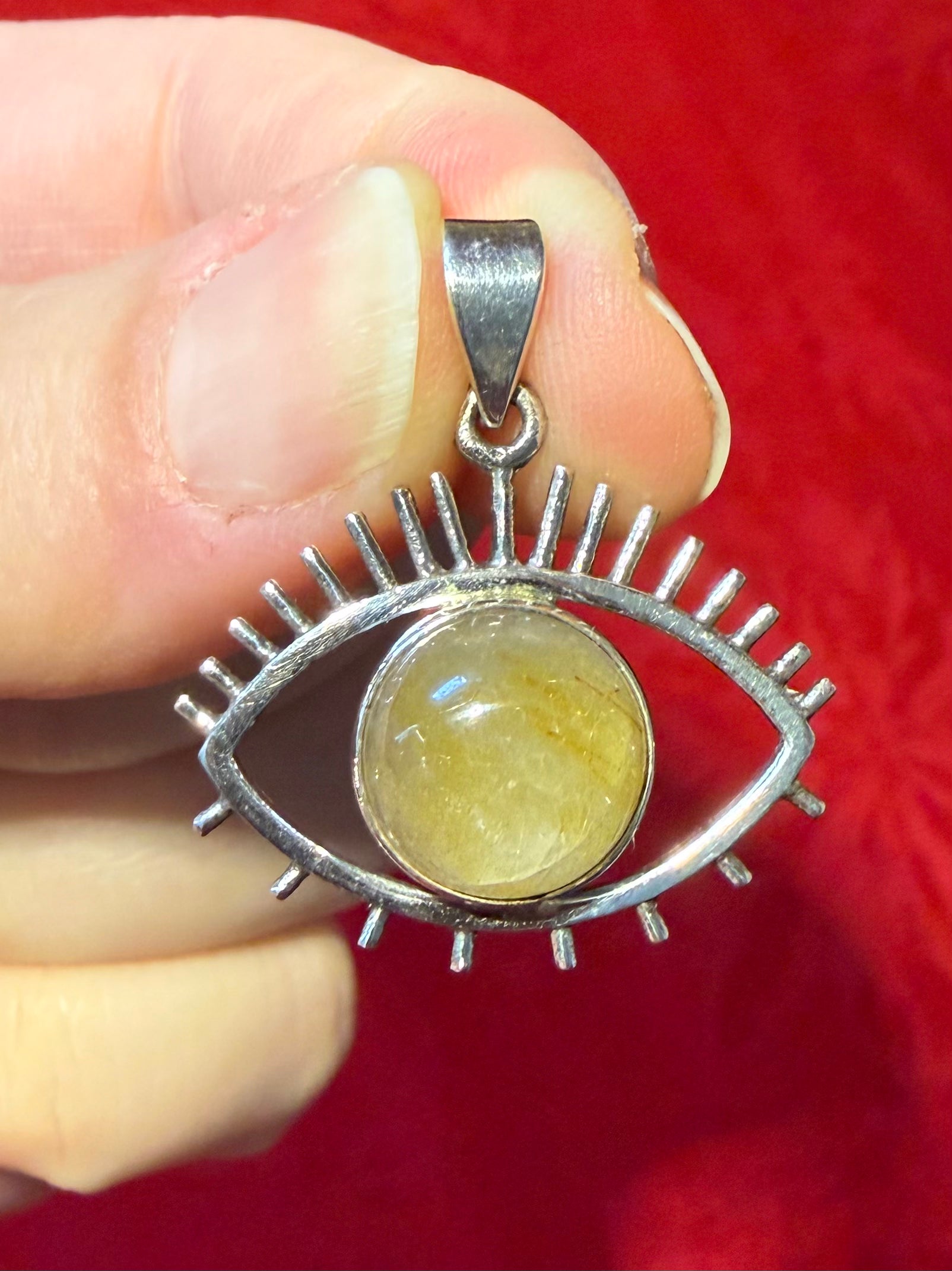 1-1/8” Rutilated Quartz Sterling Silver Eye Pendant